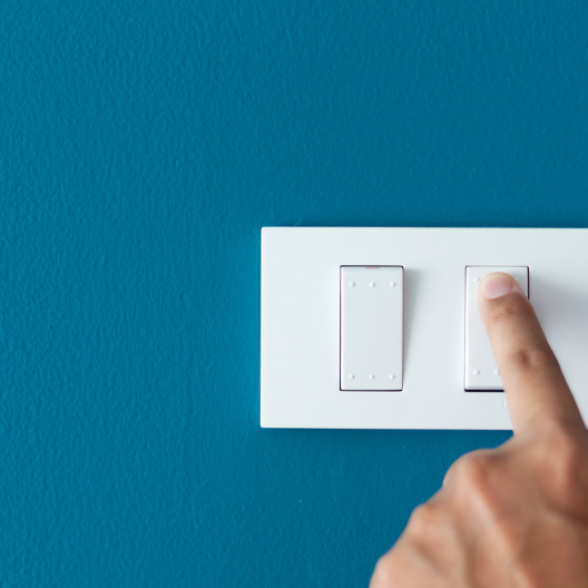 Time to switch IT Support Providers. Hand turning on light switch