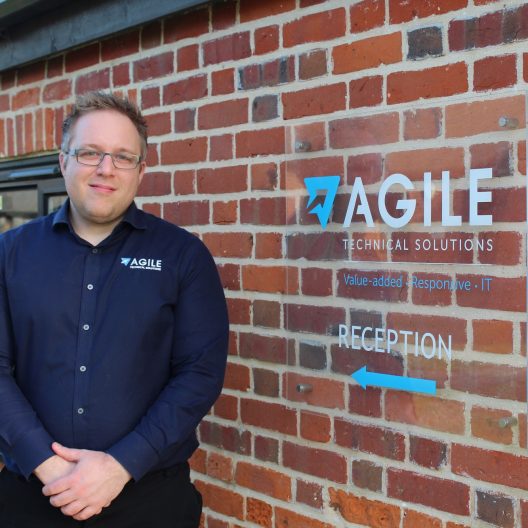 Senior IT Specialist Joe Cullen outside Agile Technical Solutions building in Langham Colchester